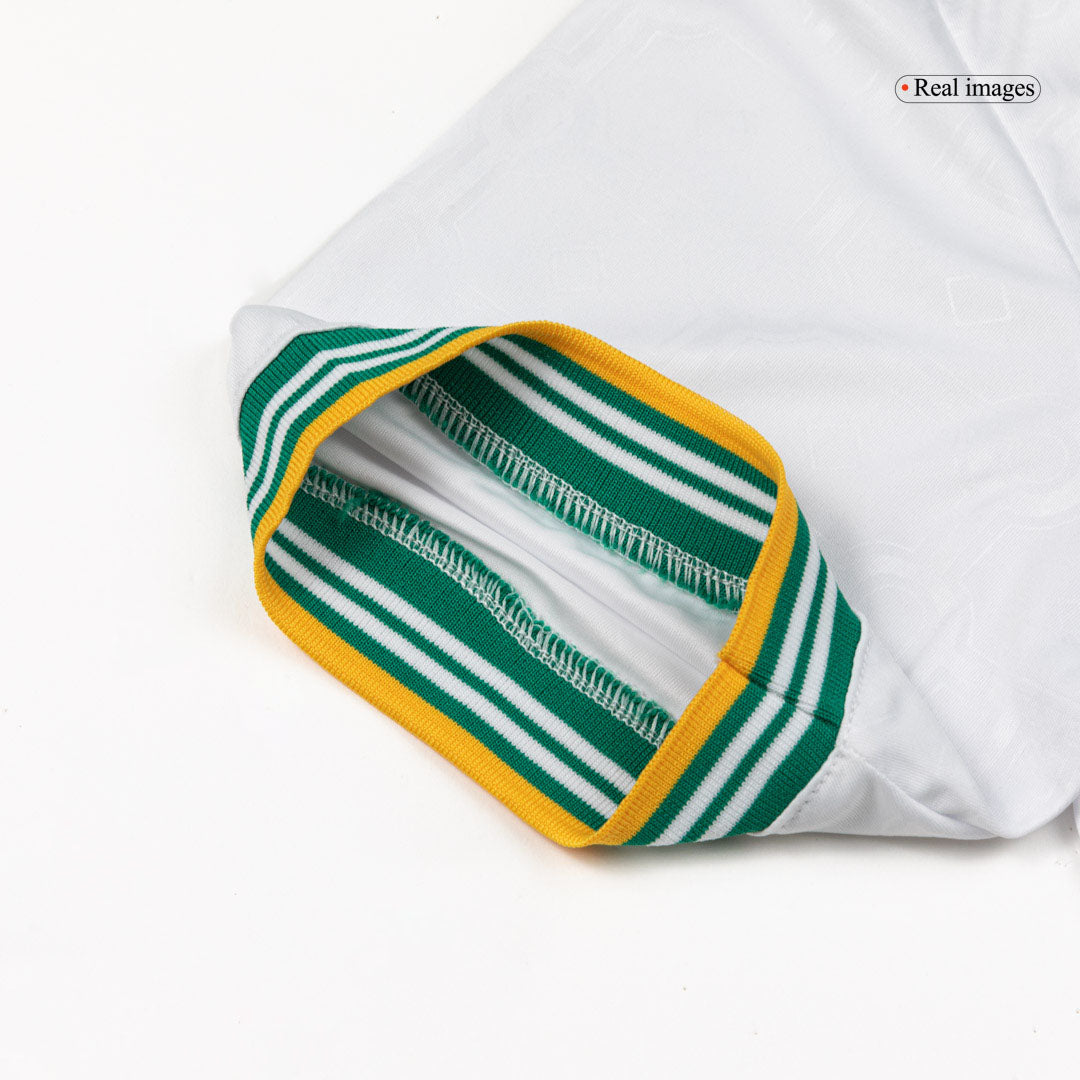 Close-up of the white, green and yellow fabric on the men's Roma 2025/26 Third jersey